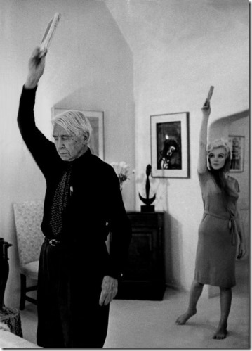 Carl Sandburg and Marilyn Monroe raising books