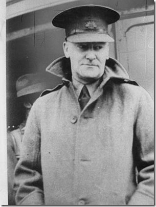 Kenneth Slessor shipboard with coat